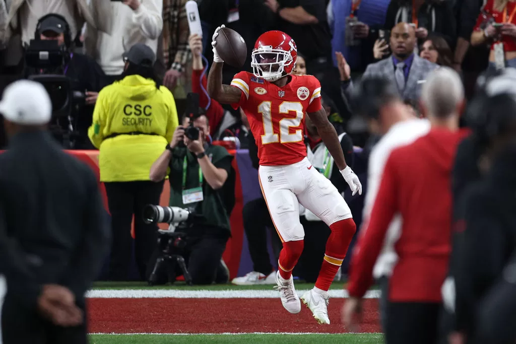 LAS VEGAS, NEVADA - FEBRUARY 11: Mecole Hardman Jr. #12 of the Kansas City Chiefs catches a pass for a touchdown to defeat the San Francisco 49ers 25-22 in overtime during Super Bowl LVIII at Allegiant Stadium on February 11, 2024 in Las Vegas, Nevada.
